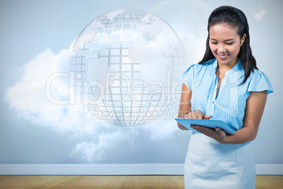 Composite image of smiling businesswoman using digital tablet