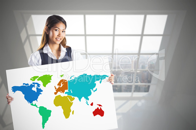 Composite image of smiling businesswoman holding a white poster