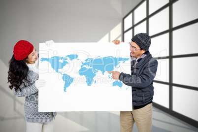 Composite image of couple with blank billboard