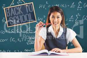 Composite image of smiling businesswoman reading