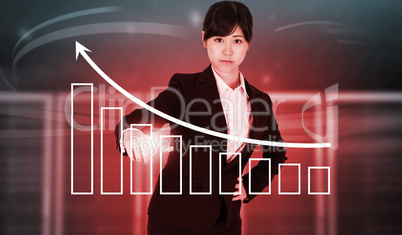 Composite image of focused businesswoman pointing