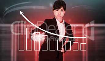 Composite image of focused businesswoman pointing