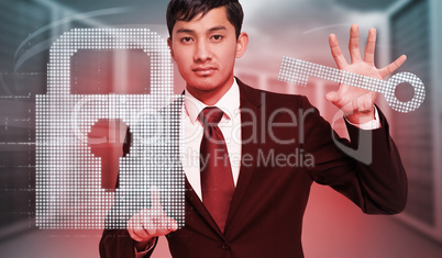 Composite image of unsmiling businessman holding and pointing