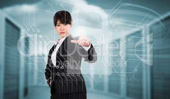 Composite image of focused businesswoman pointing