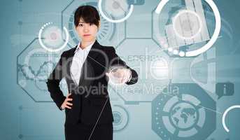 Composite image of focused businesswoman pointing