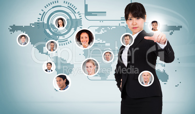 Composite image of focused businesswoman pointing