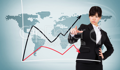 Composite image of focused businesswoman pointing