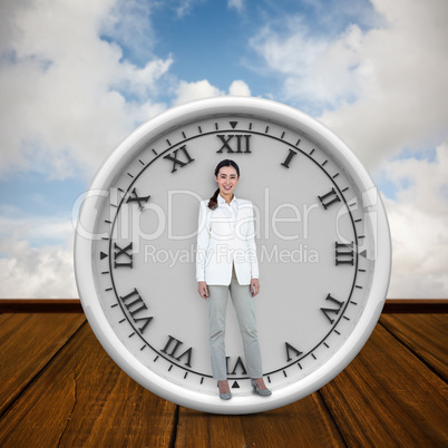 Composite image of smiling businesswoman standing straight up