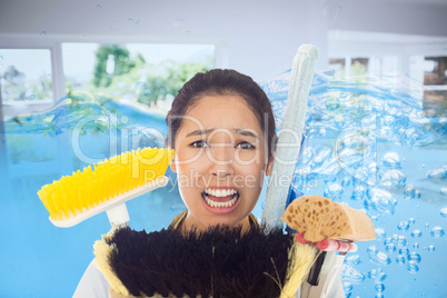 Composite image of very stressed woman with cleaning tools