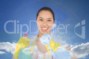 Composite image of happy woman wiping in front of her