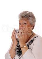 Lovely senior woman with bowl.