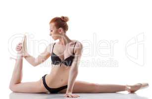 Flexible young girl posing in lingerie and pointes