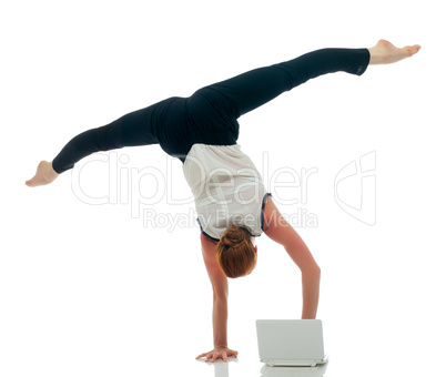 Businesswoman - acrobat working on laptop