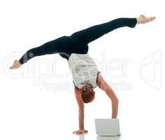 Businesswoman - acrobat working on laptop