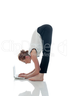Image of flexible businesswoman working on laptop