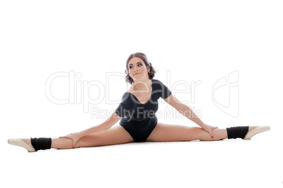 Playful gymnast doing splits, isolated on white