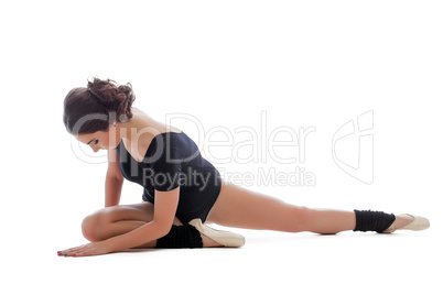 Resistant gymnast doing stretching exercises