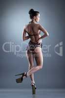 Alluring slim girl posing in erotic negligee