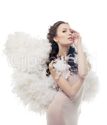 Charming sensual girl posing as angel, close-up