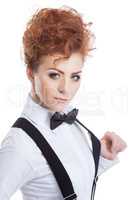 Cute red-haired model in blouse and bow-tie