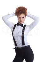 Cute redhead girl posing in suit with suspenders