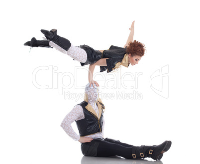 Pair of modern dancers posing in acrobatic pose
