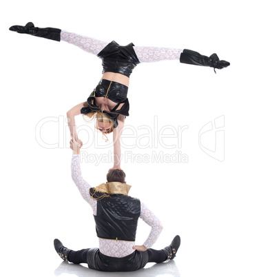 Young acrobats posing in costumes for performances