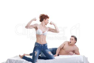 Surprised man looks at biceps of his mistress