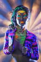 Portrait of attractive woman with UV disco make-up