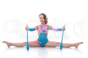 Cute gymnast posing sitting on splits with mace
