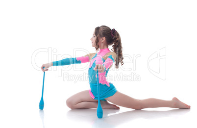 Curly girl doing gymnastic exercises with mace