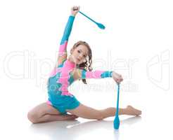 Adorable girl exercising with gymnastic mace