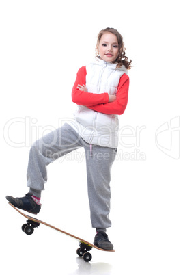 Adorable little skateboarder isolated on white