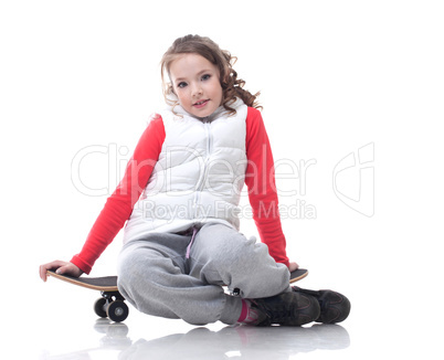 Image of cute little girl posing with skateboard