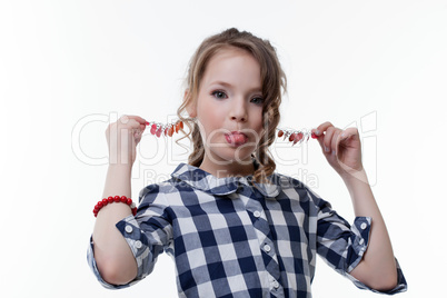 Funny little girl pulls herself for earrings
