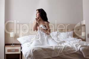 Shot of lovely model posing naked in hotel bedroom