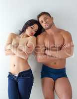 Image of scantily clad couple posing at camera