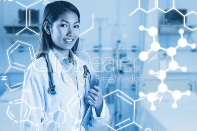 Composite image of asian doctor holding clipboard