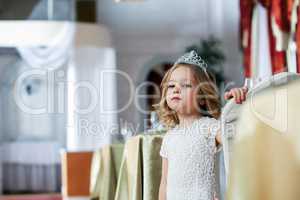 Portrait of smart little girl posing in restaurant