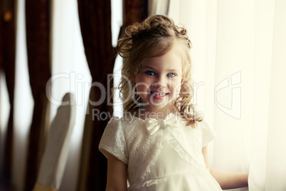 Portrait of adorable little girl with curls