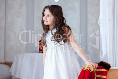 Cute little girl posing looking away from camera