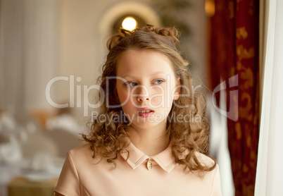 Portrait of curly girl looking away from camera
