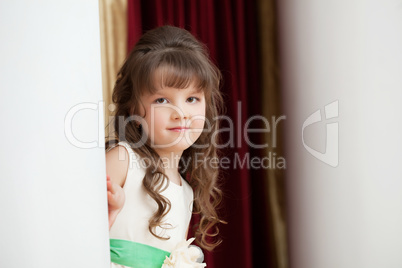 Adorable brown-eyed girl posing looking at camera