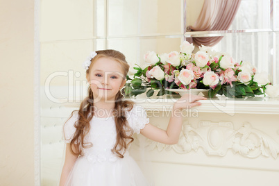 Smiling curly girl posing looking at camera