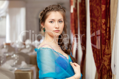 Elegant young girl posing in restaurant