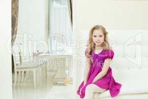 Image of smiling cute girl in smart purple dress