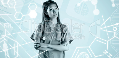 Composite image of asian nurse crossing arms