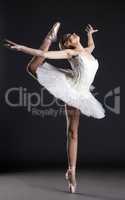 Image of flexible cute ballerina dancing in studio