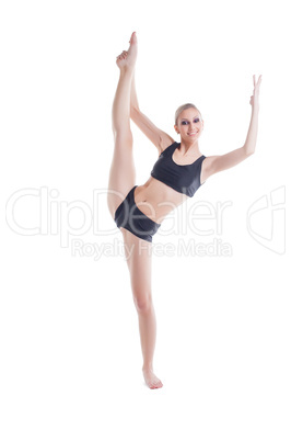 Cheerful young blonde doing stretching exercises