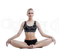 Beautiful athletic model posing in lotus position